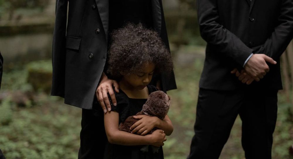A child attending a funeral.