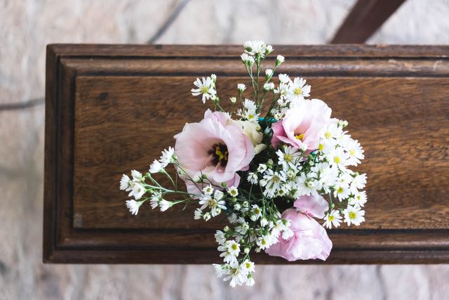 Flowers on a wooden funeral coffin. 