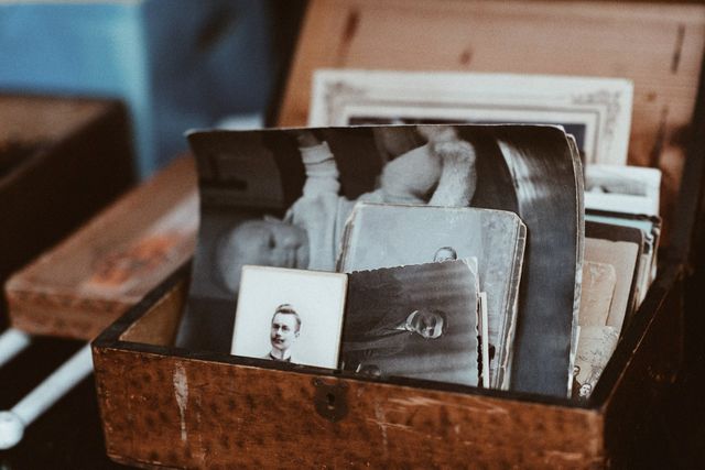 A memory box filled with old photographs.